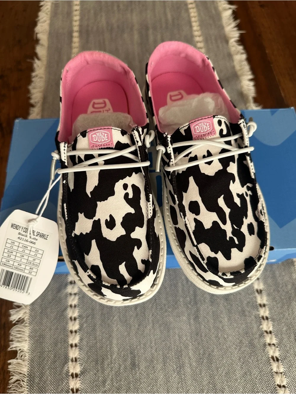 Kids' Cow Print Slip-On Shoe in Black & White with Pink Lining